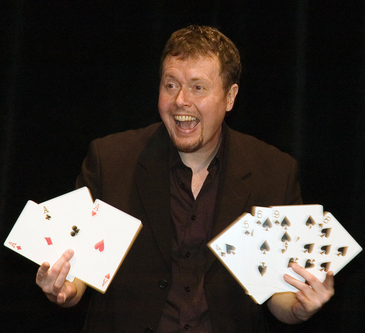 Peter holding giant cards